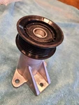 Genuine Mopar Idler Pulley Bracket 4593918AA With 04627851AA. Fixed Price $125.00.